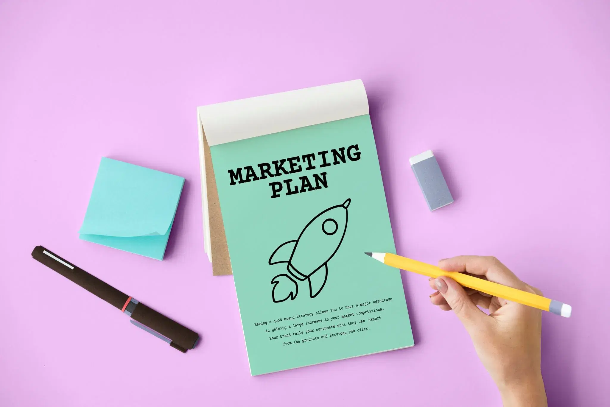 A note with a marketing plan on it.